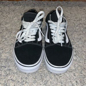 Black and white low top vans